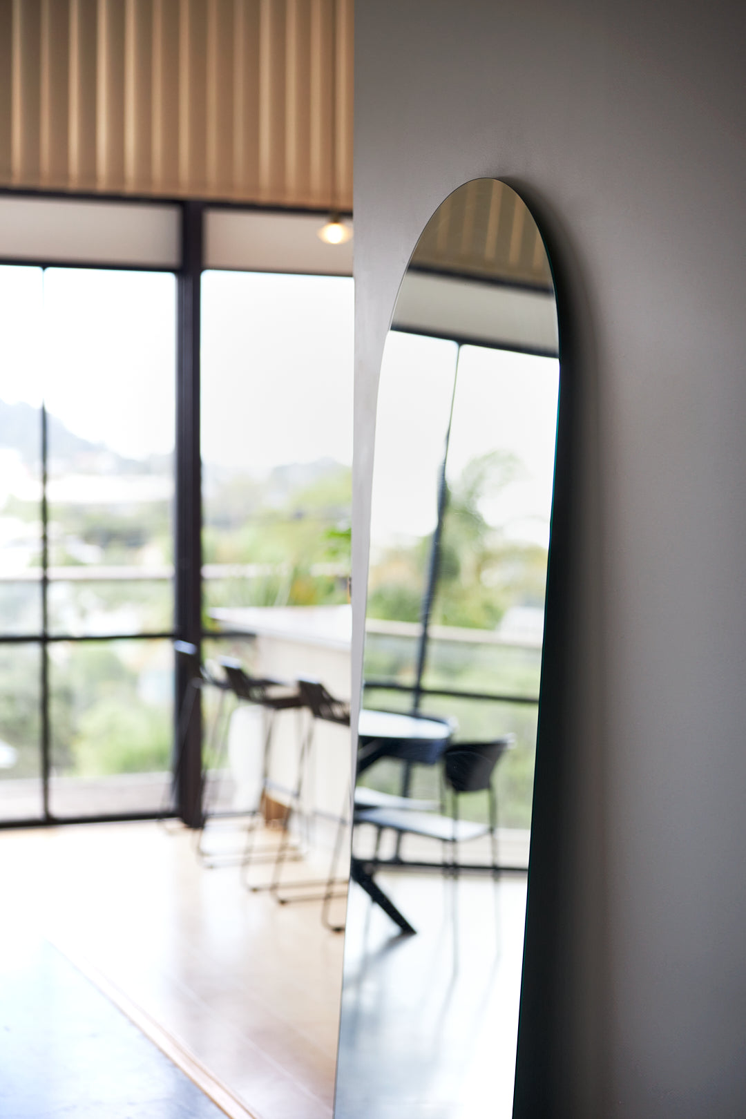 Frameless arch mirror