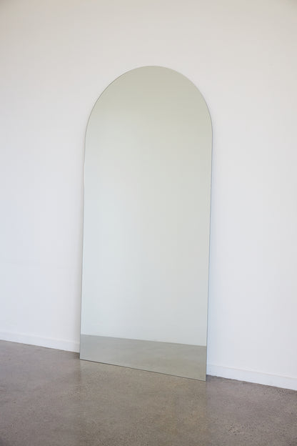 Frameless arch mirror