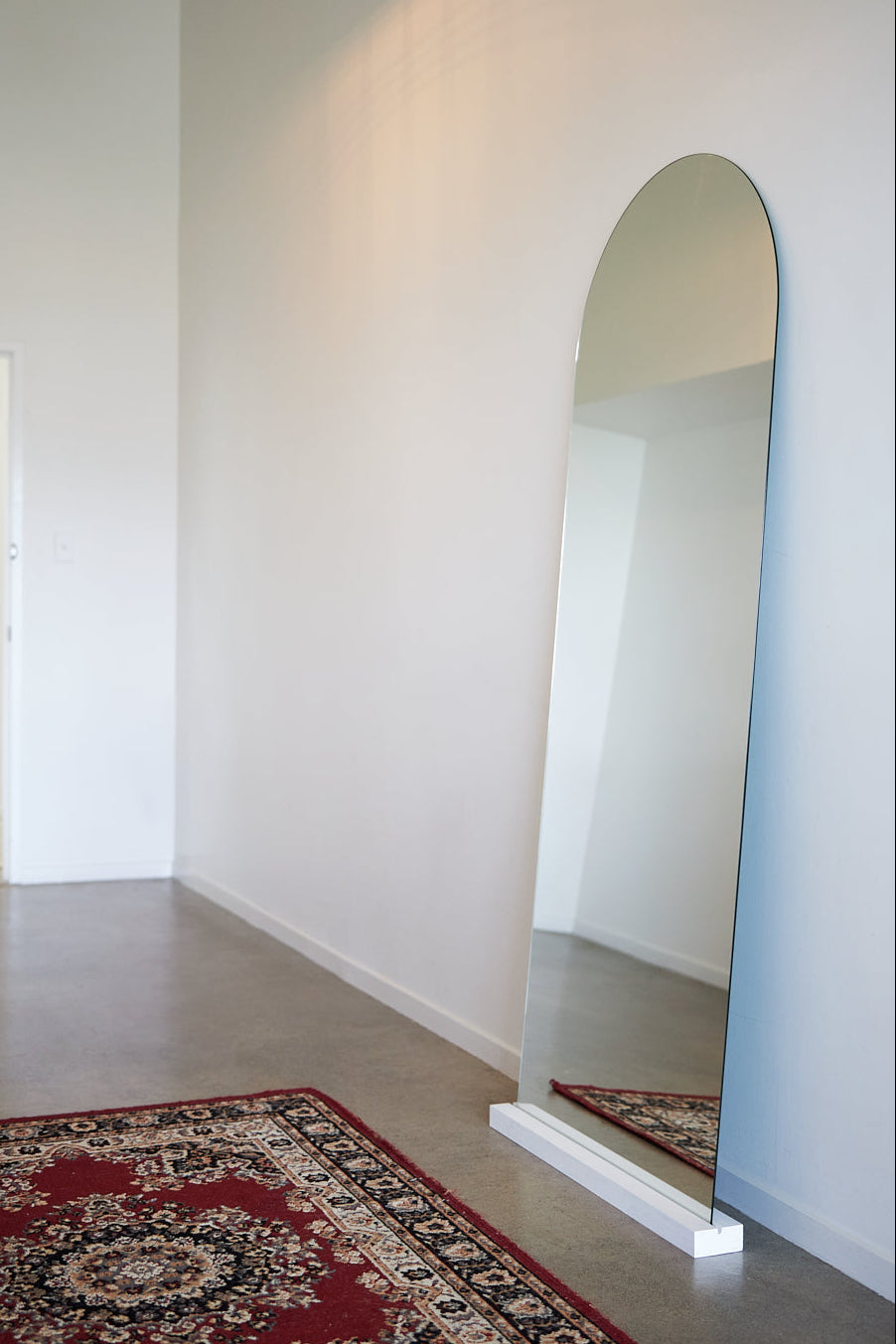 Frameless arch mirror